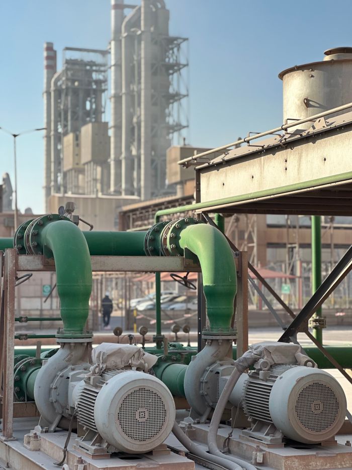 services-02 Close-up of industrial pumps at a Dubai power plant, showcasing engineering and industry.